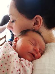 Mother Holding Sleeping Baby